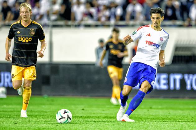 SPLIT, 15 10-2026, Poljud Stadium , season 2026 2027 , UEFA Conference League Football . Match between Hajduk Split and Ajax. Picture shows Ajax Julian Brandt and Hajduk Split Dennis Hadzikadunic Hajduk Split - Ajax  x208448957x Copyright: