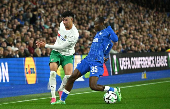 Amine Benchaib of Kauno Zalgiris tries to get past Malick Yalcouye of Brighton during the UEFA Conference League match between Brighton and Hove Albion and Kuano Zalgiris at the American Express Stadium , Brighton , UK - 15th October 2026 Brighton & Hove Albion vs Kuano Zalgiris UEFA Conference League Football, Amex Stadium, Sussex, United Kingdom - 15 Oct 2026Brighton Amex Stadium Sussex United Kingdom Editorial use only. No merchandising. For Football images FA and Premier League restrictions apply inc. no internet mobile usage without FAPL license - for details contact Football Dataco  Copyright: xSimonxDack TPI Shutterstockx 17218395m