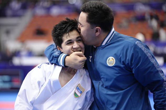 2026 World Cadet, Junior & U21, U 21 Karate Championships BIELSKO-BIALA, POLAND - OCTOBER 16: Javokhir Djakhangirov of Uzbekistan celebrates victory with his coach after winning the cadet male individual kata semi-final at the 2026 World Cadet, Junior & U21 Karate Championships at Hala Pod Debowcem on October 16, 2026 in Bielsko-Biala, Poland. Bielsko-Biala Hala Pod Debowcem Poland Copyright: x2026xKaratexInsights PSxImagesxKjetilxWaber KaratexInsightsx