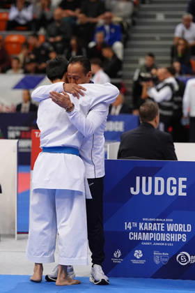 2026 World Cadet, Junior & U21, U 21 Karate Championships BIELSKO-BIALA, POLAND - OCTOBER 16: Edmond Zhuo of the United States, celebrates victory with his coach John Limcaco, after winning the cadet male individual kata semi-final at the 2026 World Cadet, Junior & U21 Karate Championships at Hala Pod Debowcem on October 16, 2026 in Bielsko-Biala, Poland. Bielsko-Biala Hala Pod Debowcem Poland Copyright: x2026xKaratexInsights PSxImagesxMartinxKremser KaratexInsightsx