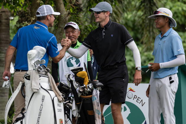 October 18, 2026, Macau, Macao Sar, China: Paul CASEY from England greets USAâ€⠢s Andy OGLETREEâ€⠢s Caddy (R) Macau Open Golf 2026 Final Round. Macau China - ZUMAr144 20261018_zap_r144_007 Copyright: xJaynexRussellx