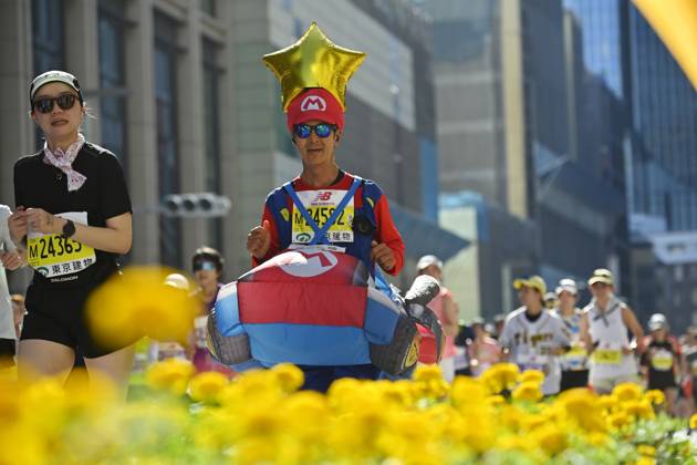 Runners take part in Tokyo Half Marathon in Japan TOKYO, JAPAN - OCTOBER 18 : Runners wearing colorful and unusual costumes participate in the Tokyo Half Marathon as they make their way through the Muromachi district in central Tokyo, Japan, October 18, 2026. David Mareuil Anadolu Tokyo Japan. Editorial use only. Please get in touch for any other usage.  Copyright: x2026xAnadoluxDavidxMareuilx