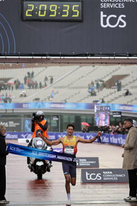RECORD DATE NOT STATED 18th October 2026; Amsterdam, Netherlands; TCS Amsterdam Marathon; Noah Schutte of the Netherlands crosses the finish line as the fastest Dutch man, 25th overall, in a time of 2:09:35 AnthonyxBenoit