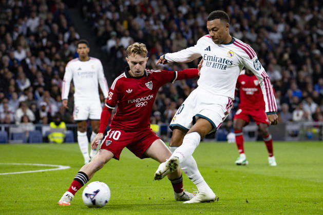 Real Madrid v Sevilla - La Liga EA Sports 2026 27 October 18, 2026, Estadio Santiago Bernabeu, Madrid, Spain: Kylian Mbappe of Real Madrid is defended by Gerard Fernandez of Sevilla during La Liga EA Sports match between Real Madrid and Sevilla at Estadio Santiago Bernabeu on October 18, 2026 in Madrid, Spain. Madrid Estadio Santiago Bernabeu Madrid Spain Copyright: xAlejandroxMatiasxAcostax