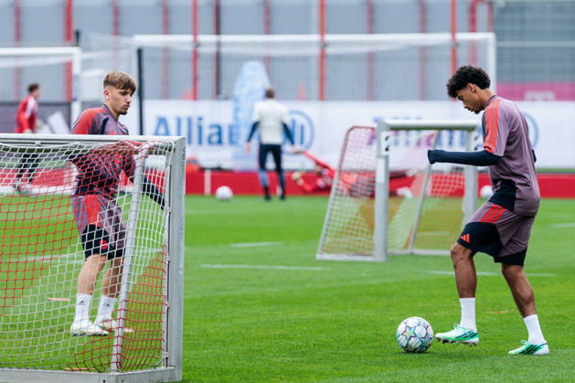 MUNICH, GERMANY - OCTOBER 20: Lennart Karl (FC Bayern Muenchen, 42) and Nathaniel Brown(FC Bayern Muenchen, 11) playing around with a ball during the training session before the UEFA Champions League match between FC Bayern Muenchen vs. Arsenal FC at Trainingsgelaende an der Saebener Str on October 20, 2026 in Munich, Germany. Bavaria Germany Copyright: xSteffiexWunderlx