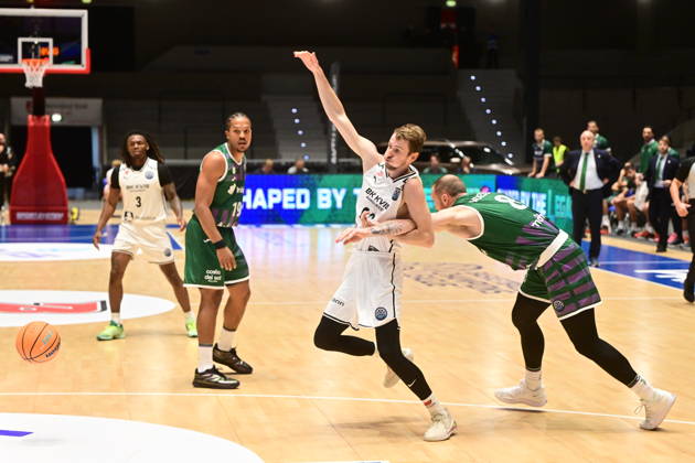 Jakub Tuma (Pardubice), middle, and Ignas Brazdeikis (Malaga), right, in action during men s Basketball Champions League, group E, 2nd round, BK KVIS Pardubice vs Unicaja Malaga, in Pardubice, Czech Republic, October 20, 2026. (CTKxPhoto JosefxVostarek) CTKPhotoP2026102006540  CTKPhotoP2026102006540