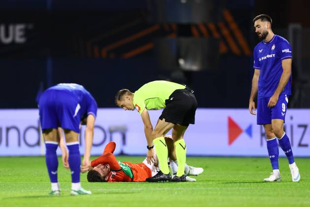 ZAGREB , 22-10-2026 , Maksimir Stadium , season 2026 2027 , Europa League football match day 3 , match between Dinamo Zagreb and NEC , Picture shows NEC player Ahmetcan Kaplan, referee Manfredas Lukjancukas, Dinamo Zagreb player Dion Beljo Dinamo Zagreb - NEC  x208957062x Copyright: