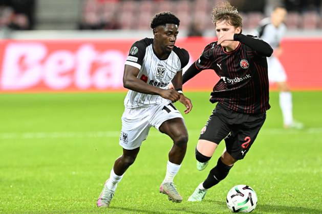 Midtjylland s Sofus Johannesen and STVV s Nathanael Mbuku pictured in action during a soccer game between Danish FC Midtjylland and Belgian Sint-Truidense VV, Thursday 22 October 2026 in Herning, Denmark, on the second day of the UEFA Conference League league phase. JILLxDELSAUX  x190690552x