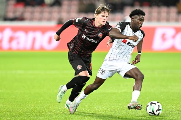 Midtjylland s Sofus Johannesen and STVV s Nathanael Mbuku pictured in action during a soccer game between Danish FC Midtjylland and Belgian Sint-Truidense VV, Thursday 22 October 2026 in Herning, Denmark, on the second day of the UEFA Conference League league phase. JILLxDELSAUX  x190690559x