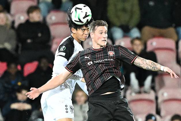 STVV s Kota Takai and Midtjylland s Mileta Rajovic pictured in action during a soccer game between Danish FC Midtjylland and Belgian Sint-Truidense VV, Thursday 22 October 2026 in Herning, Denmark, on the second day of the UEFA Conference League league phase. JILLxDELSAUX  x190690453x