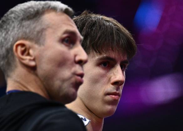 Netherlands Artistic Gymnastics World Championships 9271024 22.10.2026 Arsenii Dukhno of Team World Gymnastics Neutral Athletes 2 and his father and coach, Andrei Dukhno, are seen during the men s all-around final at the 2026 World Artistic Gymnastics Championships in Rotterdam, the Netherlands. Alexey Filippov Sputnik Rotterdam Netherlands  Copyright: xAlexeyxFilippovx