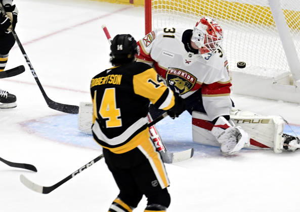 Pittsburgh Penguins left wing Nick Robertson (14) scores on Florida Panthers goalie Cooper Black (31) in the first period at PPG Paints Arena in Pittsburgh on Thursday, October 22, 2026.  PIT2026102202 ARCHIExCARPENTER