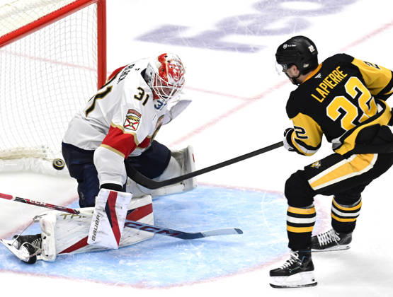 Pittsburgh Penguins center Hendrix Lapierre (22) shot finds the back of the net as he scores against Florida Panthers goalie Cooper Black (31) in the second period at PPG Paints Arena in Pittsburgh on Thursday, October 22, 2026.  PIT2026102206 ARCHIExCARPENTER