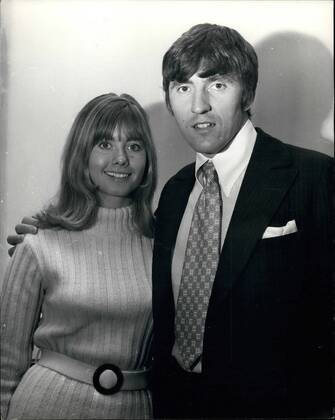 Shadows Guitarist engaged to Australian Actress: Bruce Welch, guitarist with the Shadows group, has become engaged to Olivia Newton-John, an Australian actress and singer. Bruce has been married before. Photo shows the couple pictured in London today.  - ZUMAk09