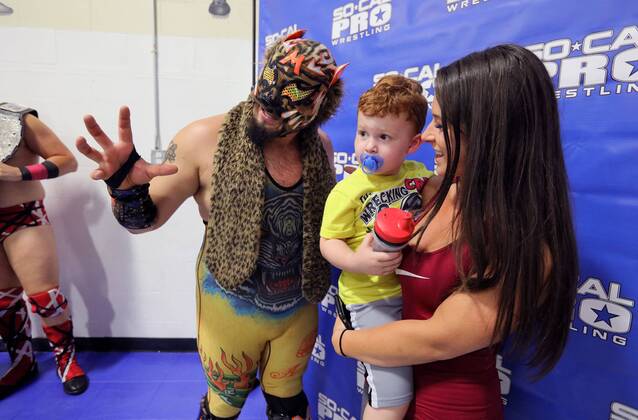 October 15, 2016 - Oceanside, California, USA - 10 15 2016_Oceanside, CA_SoCal Pro Wrestling s Rumble in Oceanside event at the Oceanside Boys & Girls Club gymnasium. During intermission wrestler Motros Jungle has his photo taken with fans Arkady Unterleidner and her son Tyson, 2._Photo by Oceanside USA - ZUMAn47_