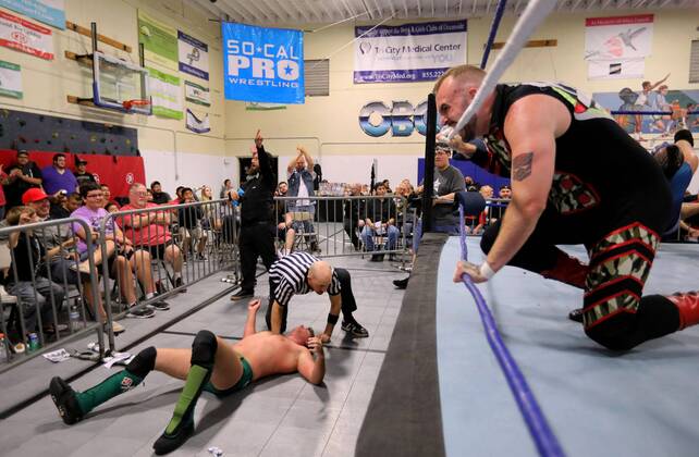 October 15, 2016 - Oceanside, California, USA - 10 15 2016_Oceanside, CA_SoCal Pro Wrestling s Rumble in Oceanside event at the Oceanside Boys & Girls Club gymnasium. Destro bites one of the ropes as he glares at the audience after forcing opponent Todd Chandler from the ring._Photo by Oceanside USA - ZUMAn47_