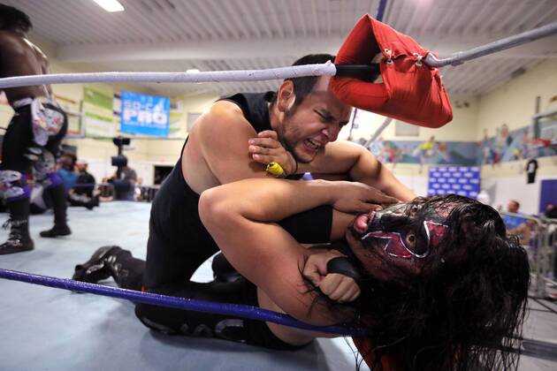 October 15, 2016 - Oceanside, California, USA - 10 15 2016_Oceanside, CA_SoCal Pro Wrestling s Rumble in Oceanside event at the Oceanside Boys & Girls Club gymnasium. Dark Usagi gets choked by an opponent during the evening s main event that included many wrestlers in the ring at the same time._Photo by Oceanside USA - ZUMAn47_