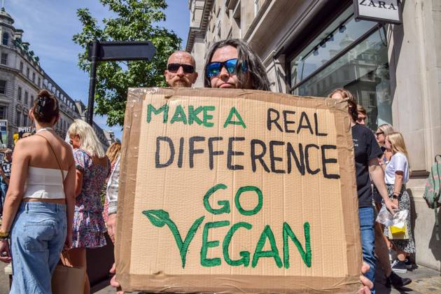 August 6, 2022, London, United Kingdom: A protester holds a pro-vegan placard during the demonstration in Regent Street. Thousands of people marched through central London in support of animal rights and veganism, and called for an end to speciesism and all forms of animal exploitation. London United Kingdom - ZUMAs197 20220806_zaa_s197_220 Copyright: xVukxValcicx
