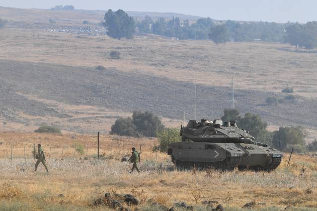 (231008) -- JERUSALEM, Oct. 8, 2023 -- This photo taken on Oct. 8, 2023 shows an Israeli tank in northern Israel near the border with Lebanon. Dozens of rockets and heavy artillery shells were fired toward Israeli positions on the Shebaa Farms, a disputed strip of land at the intersection of the Lebanese-Syrian border and the Israeli-annexed Golan Heights, early Sunday morning, Lebanese army intelligence sources confirmed to Xinhua. In response, the Israeli military fired artillery into the Lebanese area from which the attack originated, an army spokesperson said in a statement. Later, a drone attack was launched, targeting tents set up by Hezbollah in the region, according to the spokesperson. (Gil Eliyahu JINI via Xinhua) ISRAEL-BORD