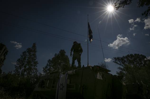 (231017) -- JERUSALEM, Oct. 17, 2023 -- This photo taken on Oct. 16, 2023 shows an Israeli soldier on a military vehicle at a camp near the Israeli-Lebanese border in northern Israel. The Israeli-Lebanese border has seen an escalation of tensions since last week as Hezbollah fired tens of rockets at Israeli military sites on Oct. 8 in support of an onslaught by the Gaza-ruling Palestinian Islamic Resistance Movement (Hamas) on Israel on Oct. 7. Hezbollah on Monday announced that it targeted five Israeli sites with rocket-propelled grenades and machine guns and inflicted Israeli injuries, to which Israel responded by firing seven missiles toward Hezbollah positions in the border town of Rmeish and shelling several Lebanese areas. ) ISRAEL-L