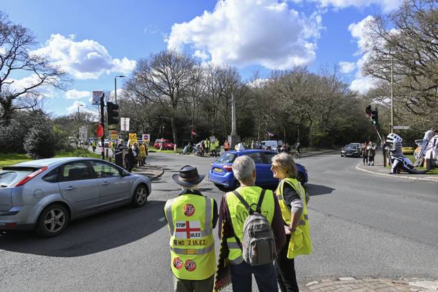 Protesters during a protest against the Ultra Low Emission Zone at the Chislehurst War Memorial in Chislehurst, London. ULEZ cameras in Chislehurst and other nearby areas have been vandalised in previous months.  Copyright: xAlanxStanfordx