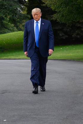 President Donald Trump Speaks to Members of the Media United States President Donald J. Trump walks to the South Lawn of the White House before boarding Marine One in Washington, D.C., U.S., on Thursday, September 24, 2020. Credit: Erin Scott Pool via CNP AdMedia Washington District of Columbia United States of America EDITORIAL USE ONLY Copyright: xx 09242020-ES-Trump-413 CNP AdMediax admphotostwo720132