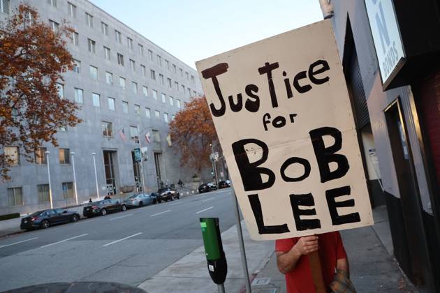 December 3, 2024, San Francisco, California, USA: A supporter for a just trial for Murdered tech executive Bob Lee relative, seen holding a sign outside the courthouse during closing arguments of the trial of Nima Momeni is, who is charged with murdering Tech executive Bob Lee in San Francisco, California. Bob Lee, who created the mobile payment service Cash App, was murdered in the cityâ€⠢s downtown Rincon Hill neighborhood on April 4, 2023. San Francisco USA - ZUMAm117 20241203_zaf_m117_217 Copyright: xDavidxG.xMcIntyrex