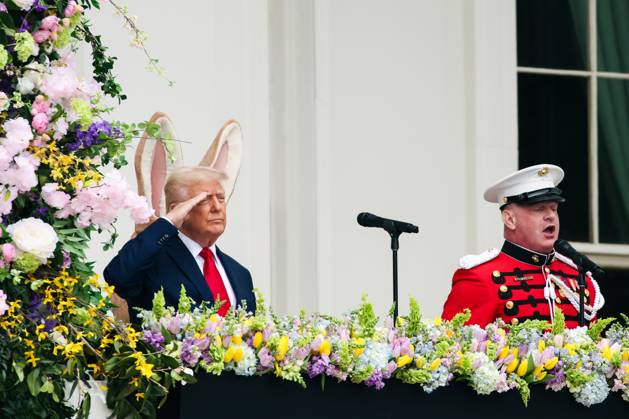 President Donald Trump salutes during the singing of the National Anthem at the 2025 Easter Egg Roll on the South Lawn of the White House in Washington DC on Monday, April 21, 2025  WAX20250421449 SamuelxCorum