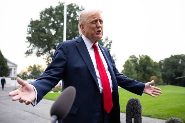 President Donald Trump speaks with reporters as he walks on the South Lawn of the White House on his way to board Marine One on Tuesday, September 30, 2025. He is on his way to Quantico to meet with military officers. WASP2025093005 FrancisxChung
