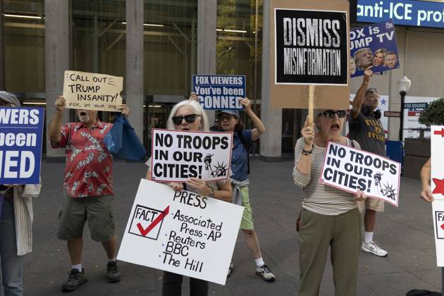 October 7, 2025, New York, New York, USA: Demonstrators denouncing Fox News as extremist right-wing propaganda in support of President Trump s administration hold signs that read NO TROOPS IN OUR CITIES! with an image of the Statue of Liberty PRESS FACT check Associated Press AP Reuters BBC The Hill DISMISS MISINFORMATION CALL OUT TRUMP INSANITY! FOX, DO YOUR JOB. FOX VIEWERS You ve been CONNED outside of News Corp s Fox News Channel in midtown Manhattan. Protesters with the activist groups Rise & Resist and Truth Tuesdays come to Fox News weekly for a peaceful demonstration calling for truth in journalism and denouncing authoritarianism, oligarchy, fascism, and Trump s agenda. New York USA - ZUMAr174 20251007_znp_r174_003 Copyright: xGinaxMxRandazzox