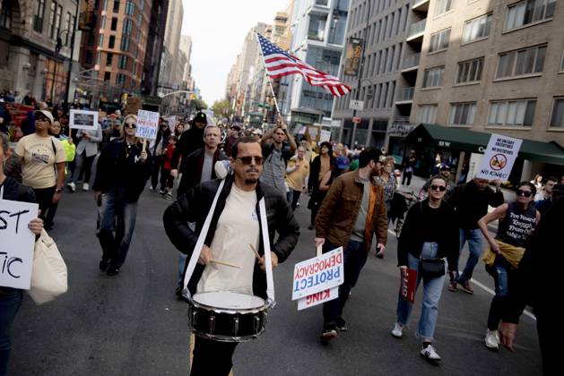October 18, 2025, New York, New York, USA: Protesters march down Broadway during the â€oeNo Kings†rally in New York, Saturday, Oct. 18, 2025. The demonstration began in Times Square and ended in Union Square, drawing an estimated 50,000 people who joined others across the country calling for the protection of democratic institutions and denouncing authoritarian leadership. Organizers said more than 5 million people participated in over 2,000 marches nationwide. New York USA - ZUMAa306 20251018_znp_a306_001 Copyright: xJavierxAlvarezx