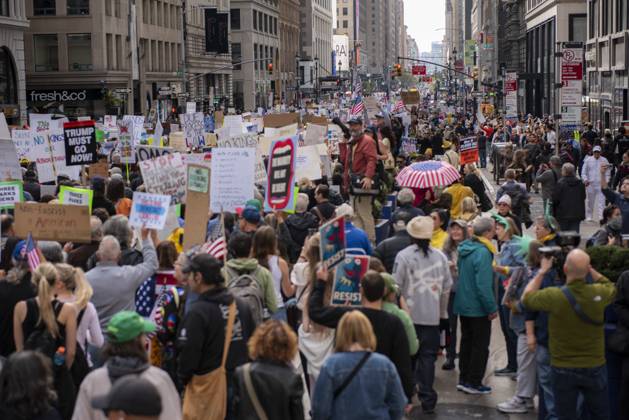 October 18, 2025, New York, New York, USA: Protesters march down Broadway during the â€oeNo Kings†rally in New York, Saturday, Oct. 18, 2025. The demonstration began in Times Square and ended in Union Square, drawing an estimated 50,000 people who joined others across the country calling for the protection of democratic institutions and denouncing authoritarian leadership. Organizers said more than 5 million people participated in over 2,000 marches nationwide. New York USA - ZUMAa306 20251018_znp_a306_006 Copyright: xJavierxAlvarezx