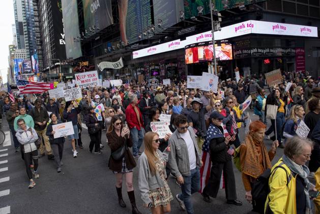 October 18, 2025, New York, New York, USA: Protesters march down Broadway during the â€oeNo Kings†rally in New York, Saturday, Oct. 18, 2025. The demonstration began in Times Square and ended in Union Square, drawing an estimated 50,000 people who joined others across the country calling for the protection of democratic institutions and denouncing authoritarian leadership. Organizers said more than 5 million people participated in over 2,000 marches nationwide. New York USA - ZUMAa306 20251018_znp_a306_011 Copyright: xJavierxAlvarezx