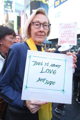 October 18, 2025, New York City, New York, USA: A woman holds a sign during the No Kings protest in New York City on Oct. 18, 2025. Tens of thousands of people hit New York City streets to protest Donald Trump, autocracy, ICE and immigrant deportations. More than 2,500 similar protests took place nationwide. New York City USA - ZUMAk45_ 20251018_zaf_k45_011 Copyright: xKristaxKennellx