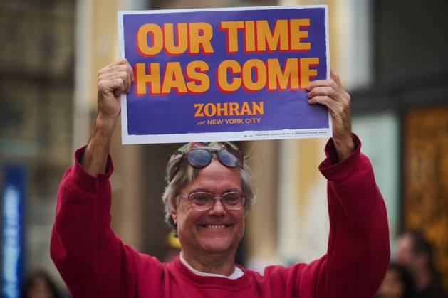 October 18, 2025, New York, New York, USA: Protester holds up a sign that reads, â€oeOur Time Has Come…Zohran for New York City†in the New York City No Kings protest in opposition to measures Donald Trump has taken to install authoritarian style rule. New York USA - ZUMAl171 20251018_znp_l171_032 Copyright: xEdnaxLeshowitzx