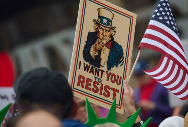 October 18, 2025, New York, New York, USA: Protester holds sign of Uncle Sam that reads, â€oeI want you to resist†in the New York City No Kings protest in opposition to measures Donald Trump has taken to install authoritarian style rule. New York USA - ZUMAl171 20251018_znp_l171_036 Copyright: xEdnaxLeshowitzx