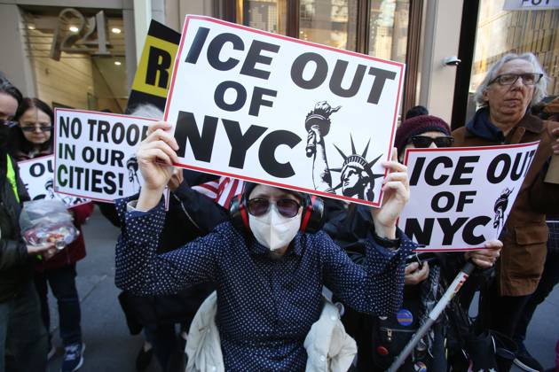 October 25, 2025, New York City, New York, USA: A woman holds a sign that says ICE Out of NYC during a Hands Off NYC rally outside of Trump Tower on October 25, 2025. Some women wore polka dots in honor of a protestor who confronted ICE agents and tank vehicles. The peaceful rally drew a handful of Trump supporters. New York City USA - ZUMAk45_ 20251025_zaf_k45_015 Copyright: xKristaxKennellx