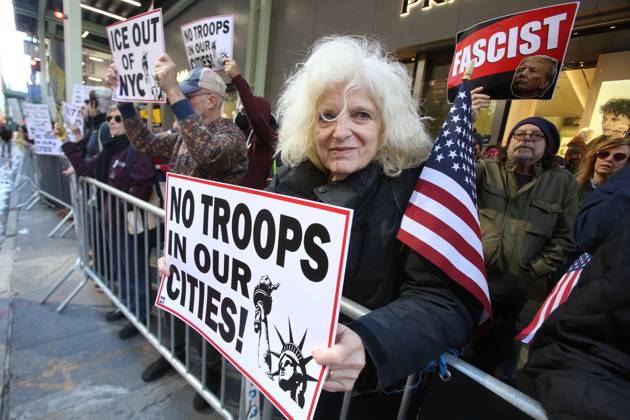 October 25, 2025, New York City, New York, USA: A woman holds a sign during a Hands Off NYC rally outside of Trump Tower on October 25, 2025. Some women wore polka dots in honor of a protestor who confronted ICE agents and tank vehicles. The peaceful rally drew a handful of Trump supporters. New York City USA - ZUMAk45_ 20251025_zaf_k45_039 Copyright: xKristaxKennellx