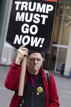 October 28, 2025, New York, New York, USA: A demonstrator holds a sign that reads TRUMP MUST GO NOW! joining peaceful protesters outside of News Corp s Fox News Channel in midtown Manhattan. People with the activist groups Rise & Resist and Truth Tuesdays call for truth in journalism and denounce ICE, Federal troops sent to cities and Fox News as extremist right-wing propaganda in support of President Trump s administration. New York USA - ZUMAr174 20251028_znp_r174_027 Copyright: xGinaxMxRandazzox