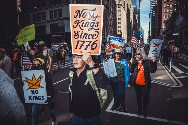October 18, 2025, New York, New York, USA: A demonstrator holds a sign while marching during the second No Kings protest in Manhattan. An estimated 350,000 attended this event. New York USA - ZUMAp287 20251018_znp_p287_004 Copyright: xFarhadxParsax