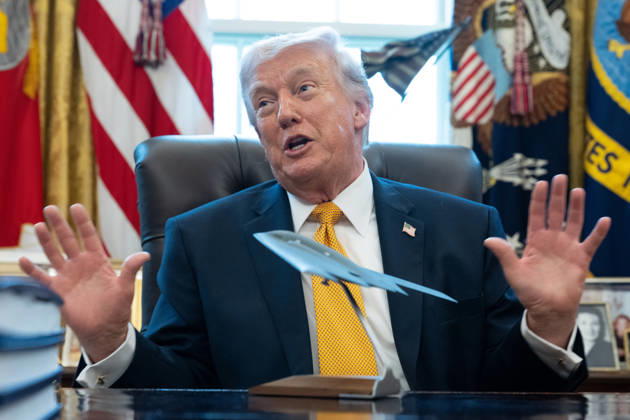 President Donald Trump gives remarks with a model stealth bomber on the Resolute Desk during an Executive Order signing event in the Oval Office of the White House in Washington, DC on Monday, March 16, 2026. The order will formally launch a task force, led by Vice President JD Vance, to investigate fraud nationwide. WAP20260316075 AARONxSCHWARTZ