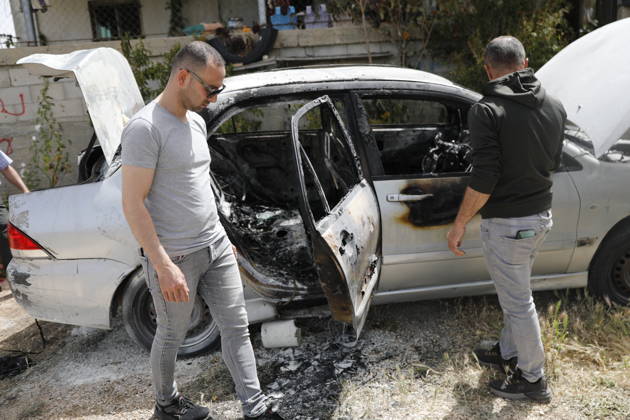 Palestinians inspect damage after settler attack near Hebron Palestinians inspect damage at the site of an attack carried out by Israeli settlers targeting Palestinian vehicles and property in the town of Surif northwest of Hebron in the occupied West Bank on May 17, 2026. Settlers set fire to a vehicle and spray-painted racist slogans at the scene, amid anger and condemnation among Palestinian residents over repeated attacks on their property. Photo by Mamoun Wazwaz apaimages Hebron West Bank Palestinian Territory 170526_Hebron_MW_00(14) Copyright: xapaimagesxMamounxWazwazx xapaimagesx