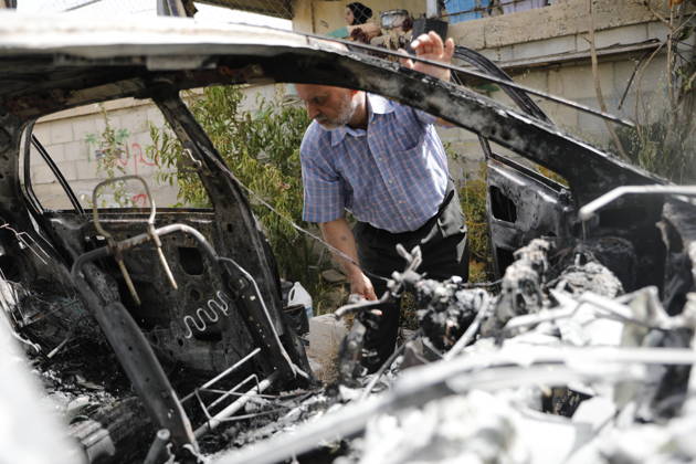 Palestinians inspect damage after settler attack near Hebron Palestinians inspect damage at the site of an attack carried out by Israeli settlers targeting Palestinian vehicles and property in the town of Surif northwest of Hebron in the occupied West Bank on May 17, 2026. Settlers set fire to a vehicle and spray-painted racist slogans at the scene, amid anger and condemnation among Palestinian residents over repeated attacks on their property. Photo by Mamoun Wazwaz apaimages Hebron West Bank Palestinian Territory 170526_Hebron_MW_00(5) Copyright: xapaimagesxMamounxWazwazx xapaimagesx