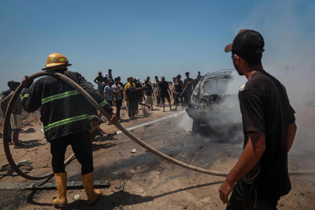 Israeli attacks continue in Gaza GAZA, PALESTINE - JULY 21 : Firefighters and local Palestinians attempt to extinguish a burning civilian vehicle after it was targeted in an Israeli attack in the Nuseirat refugee camp in the central Gaza Strip on July 21, 2026 in Gaza, Palestine. Abdalhkem Abu Riash Anadolu Gaza City Gaza. Editorial use only. Please get in touch for any other usage.  Copyright: x2026xAnadoluxAbdalhkemxAbuxRiashx