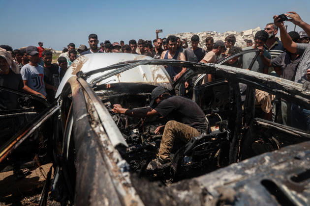 Israeli attacks continue in Gaza GAZA, PALESTINE - JULY 21 : Firefighters and local Palestinians attempt to extinguish a burning civilian vehicle after it was targeted in an Israeli attack in the Nuseirat refugee camp in the central Gaza Strip on July 21, 2026 in Gaza, Palestine. Abdalhkem Abu Riash Anadolu Gaza City Gaza. Editorial use only. Please get in touch for any other usage.  Copyright: x2026xAnadoluxAbdalhkemxAbuxRiashx