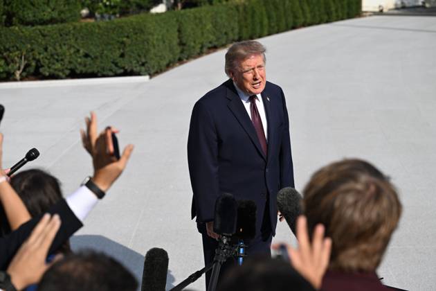 October 2, 2026, Washington, Dc, USA: U.S. President Donald Trump talks to the media before boarding Marine One on the South Lawn of the White House in Washington, DC, United States, on October 2, 2026. Washington USA - ZUMAs197 20261002_aaa_s197_276 Copyright: xKylexMazzax