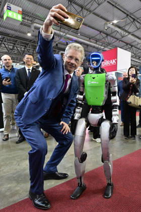 Czech Senate President Milos Vystrcil takes a selfie with a humanoid robot at opening of the 67th International Engineering Fair, which begins at Vystaviste 1 exhibition grounds in Brno, Czech Republic, on October 6th, 2026. International Fair of Machine Tools and Forming Machines IMT, International Welding Engineering Fair Welding, International Fair of Plastics, Rubber and Composites Plastex, International Fair of Surface Treatment Technologies Profintech and International Foundry Fair Fond-Ex also start. (CTKxPhoto VaclavxSalek) CTKPhotoP2026100605272 CTKPhotoP2026100605272