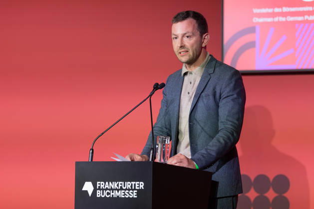Buchmesse Frankfurt 2026 Sebastian Guggolz, Vorsteher des Börsenvereins des Deutschen Buchhandels, spricht während der Pressekonferenz. Eröffnungspressekonferenz der Buchmesse Frankfurt 2026., Frankfurt am Main Hessen Deutschland Messegelände