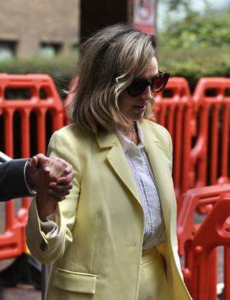 Russell Brand and his wife leave court in London LONDON, UNITED KINGDOM - OCTOBER 6: British comedian Russell Brand (not seen) leaves Southwark Crown Court with his wife, Laura Brand, following a preliminary hearing related to rape and sexual assault allegations against him in London, United Kingdom, on October 6, 2026. Rasid Necati Aslim Anadolu London United Kingdom. Editorial use only. Please get in touch for any other usage. Copyright: x2026xAnadoluxRasidxNecatixAslimx