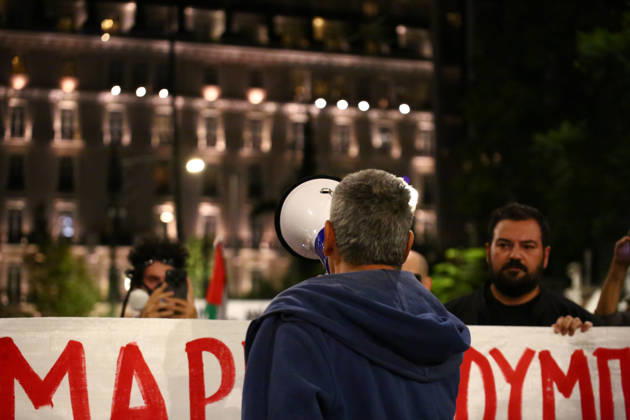 October 6, 2026, Athens, Attica, GREECE: A protester speaks through a megaphone in front of a banner opposing the visit of US Secretary of State MARCO RUBIO during an anti-war demonstration. Athens GREECE - ZUMAx103 20261006_zip_x103_009 Copyright: xHarrisxXanthopoulosx